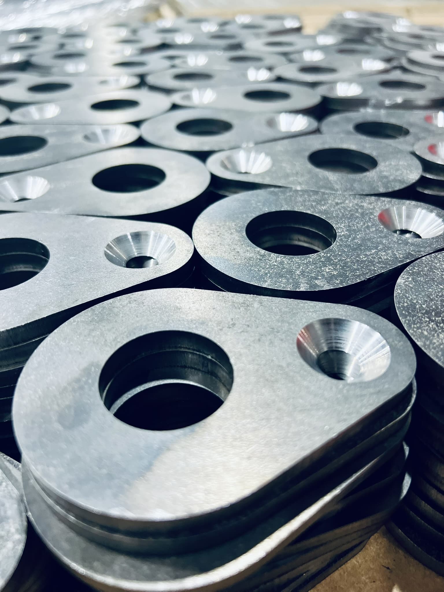 Finished machined components staged for assembly